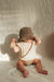 Knitted romper with ribbed design – soft cotton blend, easy popper fastening | Baby clothing