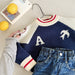 Knitted jumper keeps little ones warm – ribbed cuffs, bird print | boys
