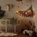 Macrame toy storage net keeps nurseries tidy – space-saving, sturdy cotton, boho style | kids' room