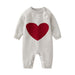 Knitted heart romper keeps baby cosy – soft cotton mix, long sleeves | jumpsuit