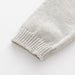 Knitted heart romper keeps baby cosy – soft cotton mix, long sleeves | jumpsuit